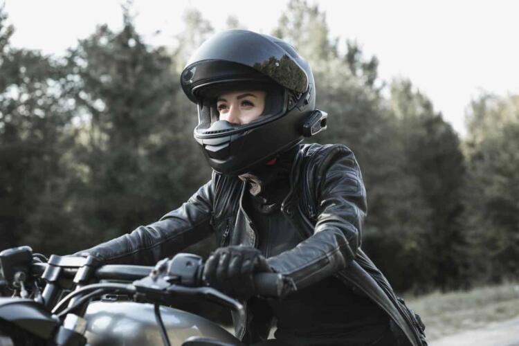 Young woman driving motorcycle