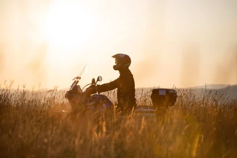 Driver riding motorcycle at countryside