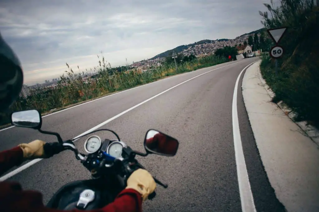 POV motorcycle driver on empty road