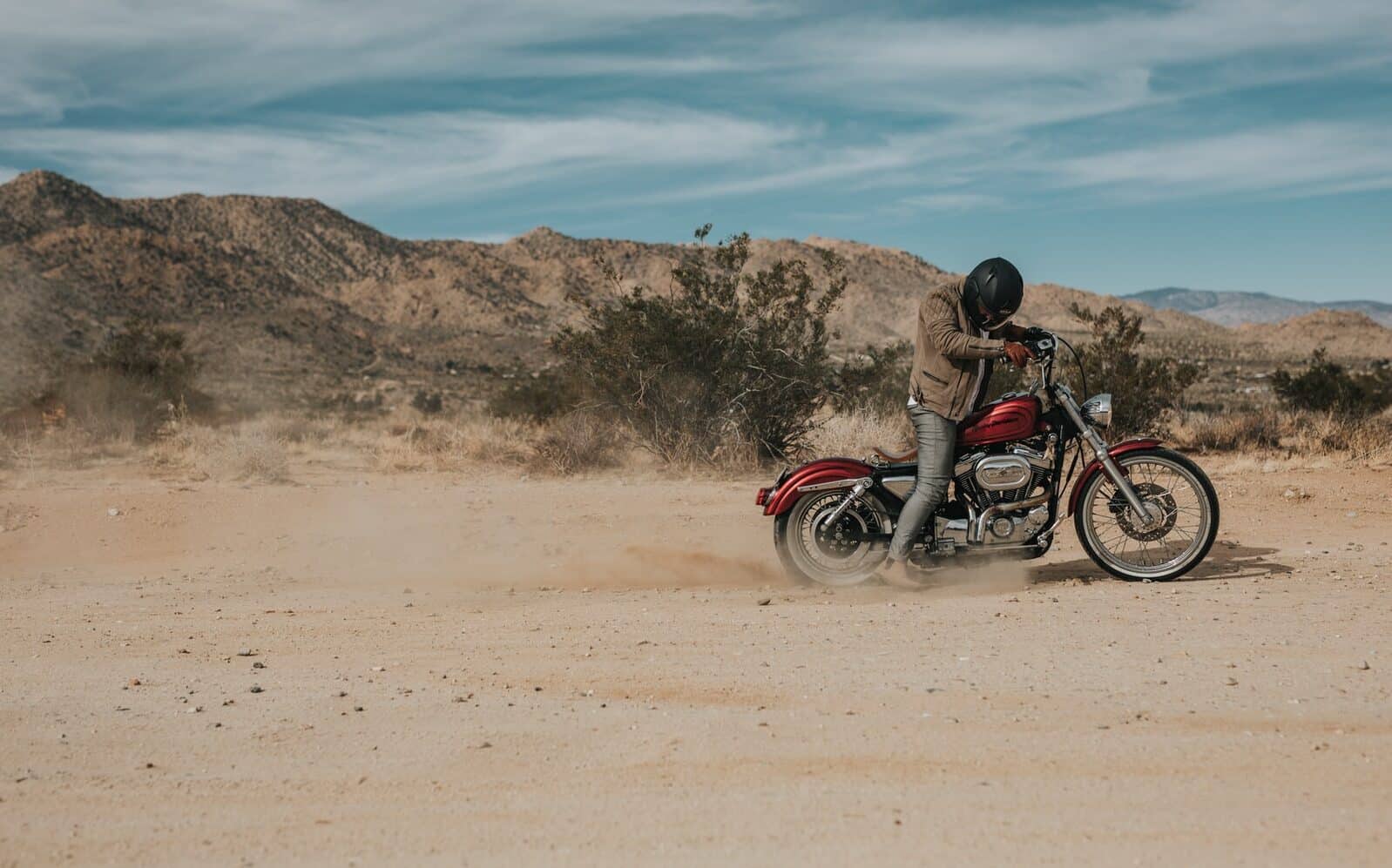 man riding cruiser motorcycle