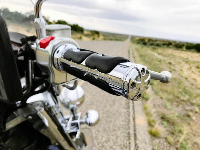 motorcycle with chrome hand grip stopped at roadside